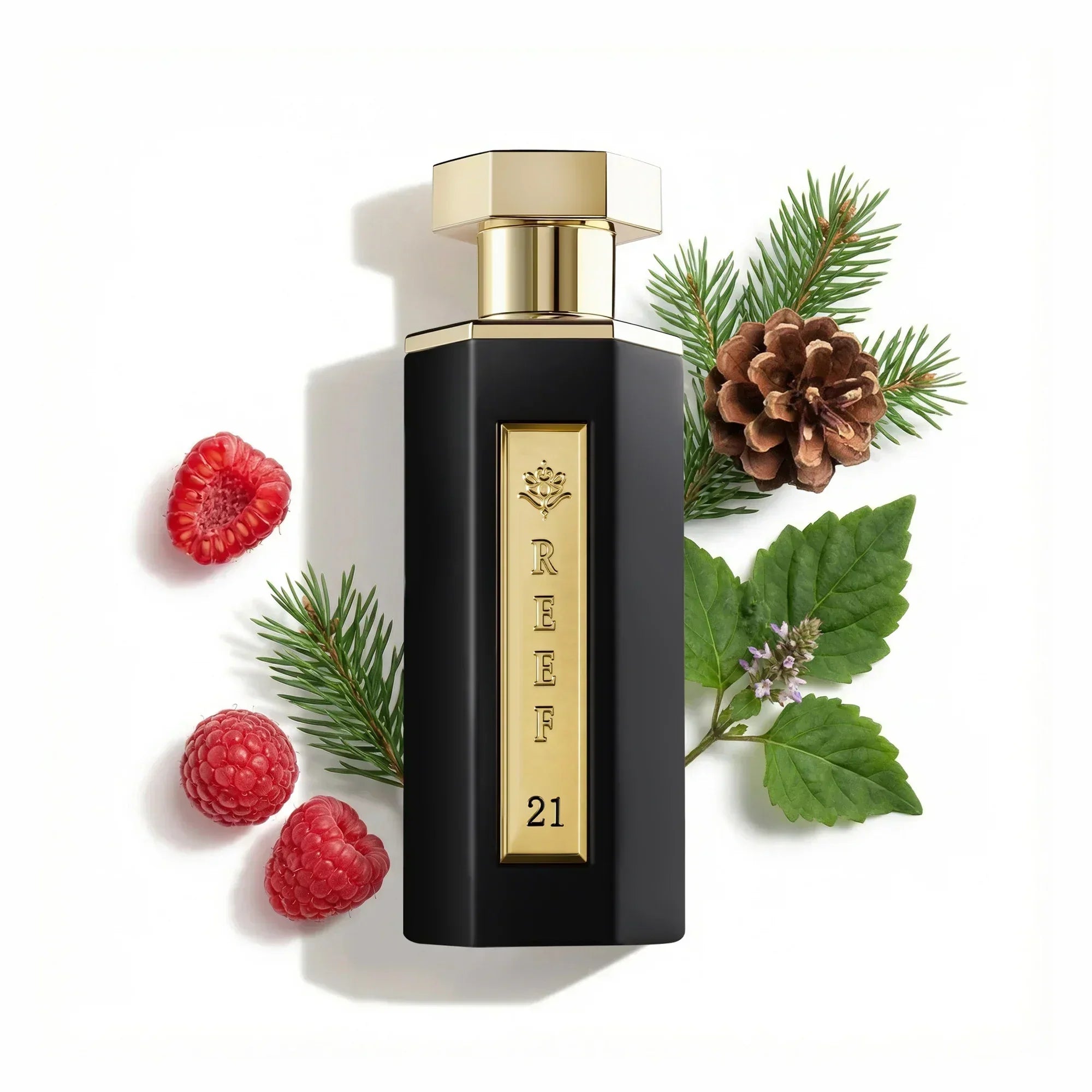 REEF 21 perfume bottle with raspberries, pinecone, and greenery, evoking oriental fragrance notes